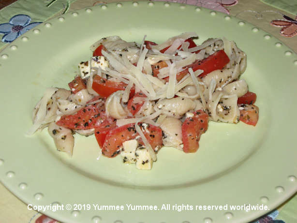Garden fresh tomatoes, feta cheese, brown rice pasta and topped with Parmesan cheese - Yum.