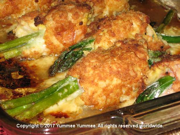 Parmesan Crusted Stuffed Chicken is a gluten-free treat. A gentle crust wraps around the chicken which encases provolone cheese, ham, and asparagus.