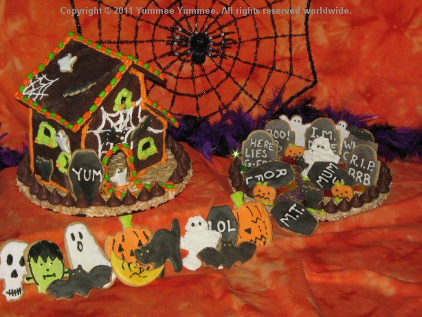 A Haunted House and ghostly graveyard for a Halloween centerpiece.