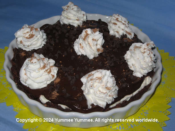 It's a combination of flavors in one dessert - brownies, ice cream sundae, & cheesecake.