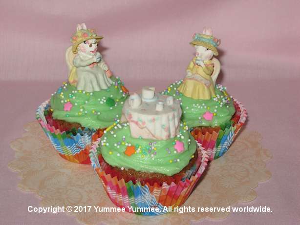 Use figurines to decorate cupcakes.