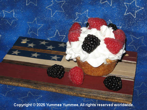 Garnish Sugar Cookie Muffins with whipped cream and fresh berries!